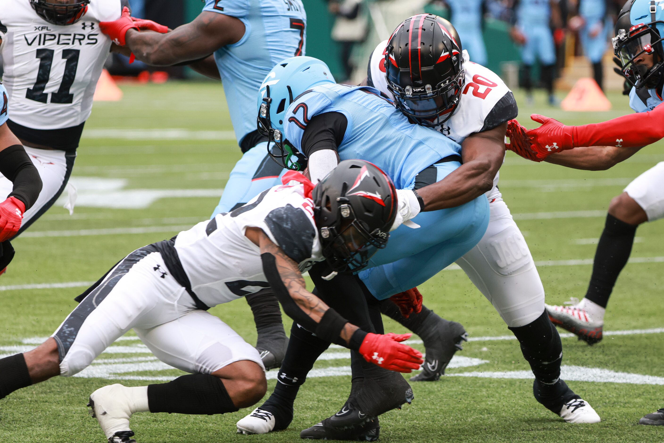 Vegas Vipers Adam Sparks (22) and Jawuan Johnson (20) tackle Arlington Renegades Adrian...