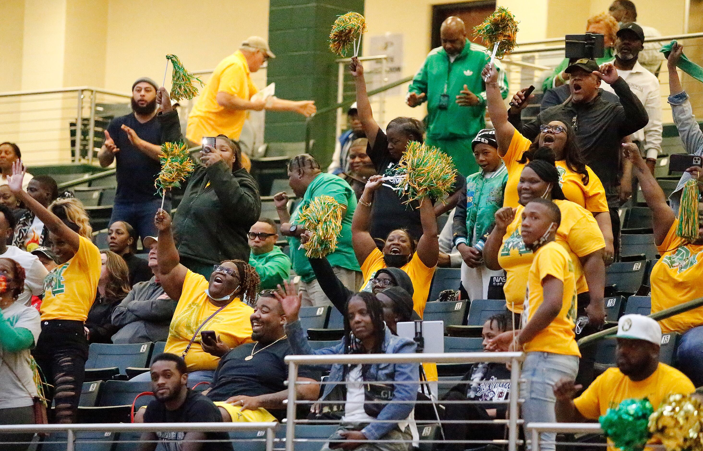Madison fans cheer their team on during the second half of the 3A Region II championship...