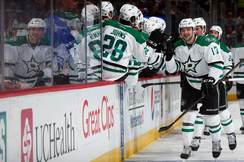 Dallas Stars center Devin Shore celebrates a goal with teammates on the bench against the...