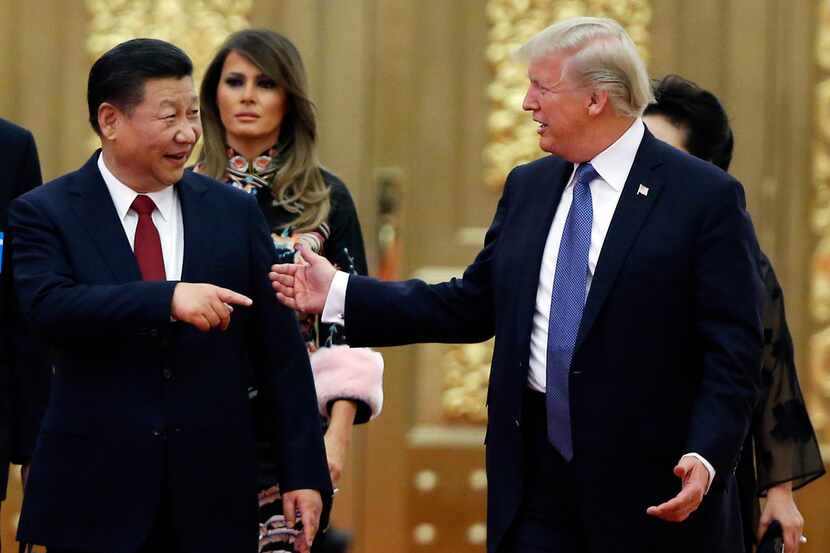 U.S. President Donald Trump (right) and China's President Xi Jinping arrive for a state...