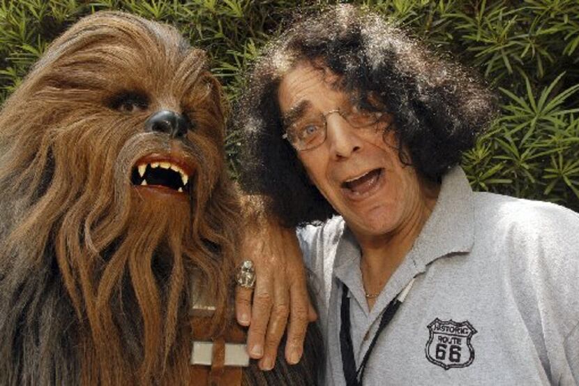 Actor Peter Mayhew,who played Chewbacca in Star Wars movies, posed with a Chewbacca...