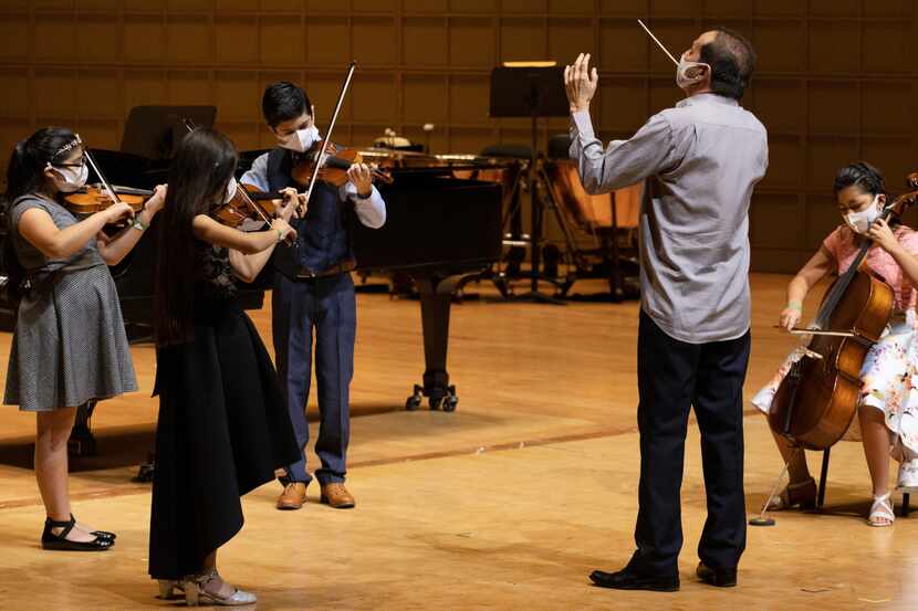 Roberto Zambrano (Artistic Director of Young Musicians Program) conducts four Young...