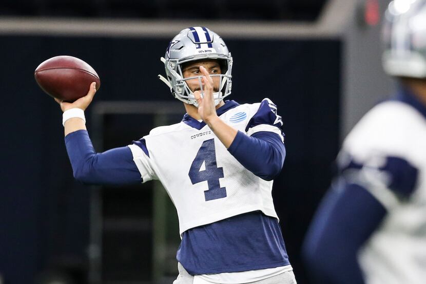 Dallas Cowboys quarterback Dak Prescott (4) looks to make a pass during a Cowboys practice...