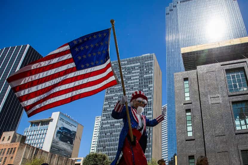 A costumed character of Uncle Sam on stilts -- bearing a 28-state American flag, for when...