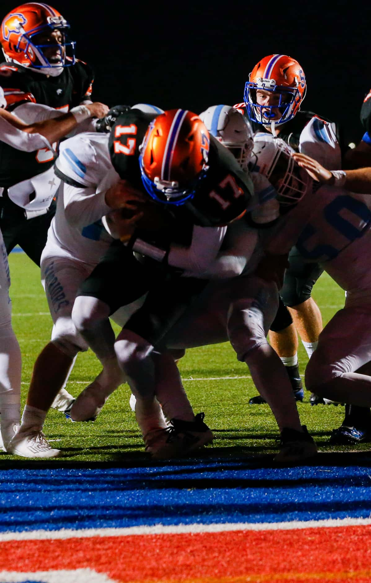 Colleyville Covenant's Austin Scheets (17) runs in a touchdown in the fourth quarter of a...