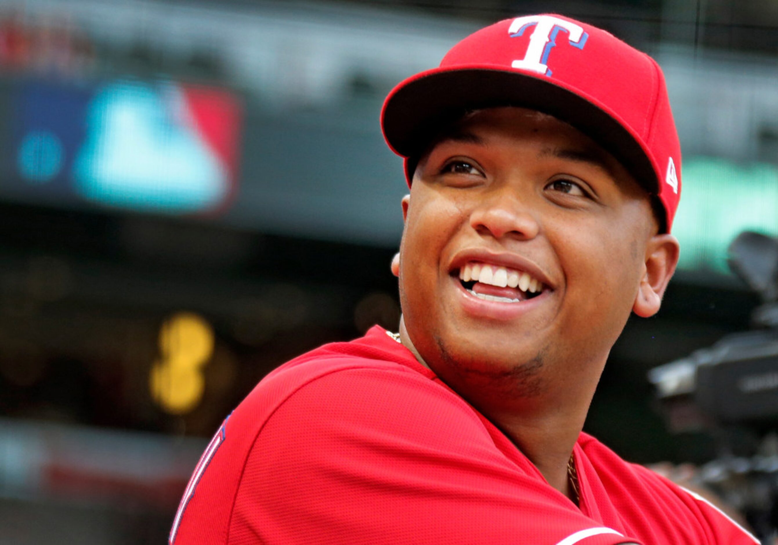 Texas Rangers designated hitter Willie Calhoun (5) is pictured in the dugout before the...