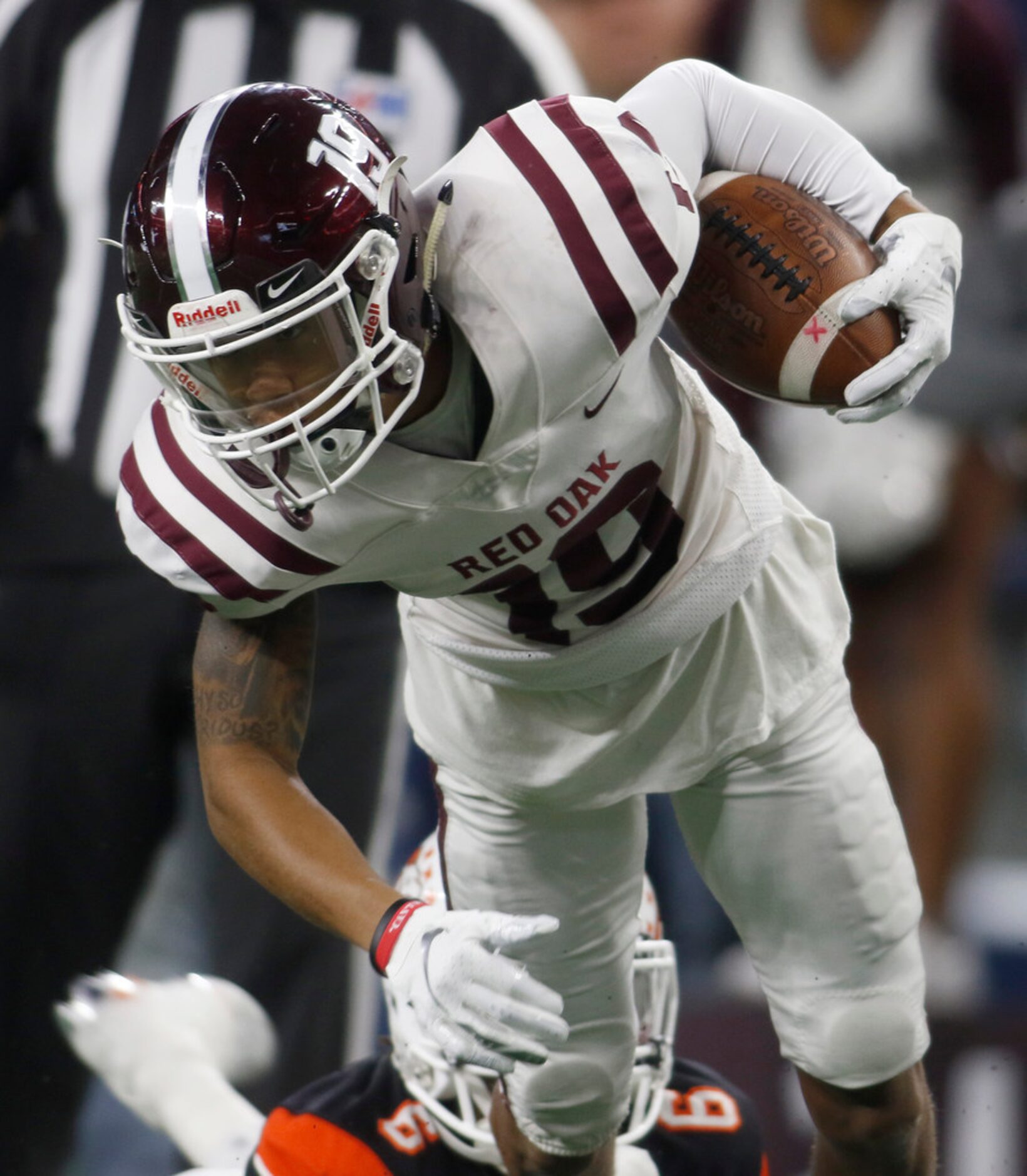 Red Oak receiver Coby Cavill (19) is stopped by Aledo defender DeMarco Roberts (6) following...