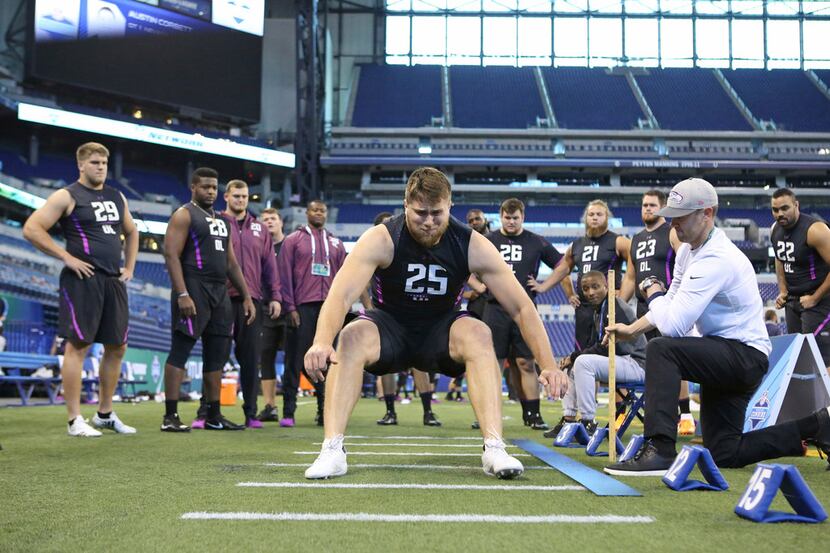UCLA offensive lineman Kolton Miller participates in the broad jump at the 2018 NFL scouting...