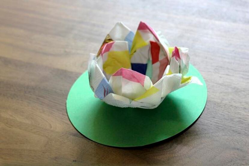 THERE ARE MANY  different designs for origami flowers. This one looks like a lotus.