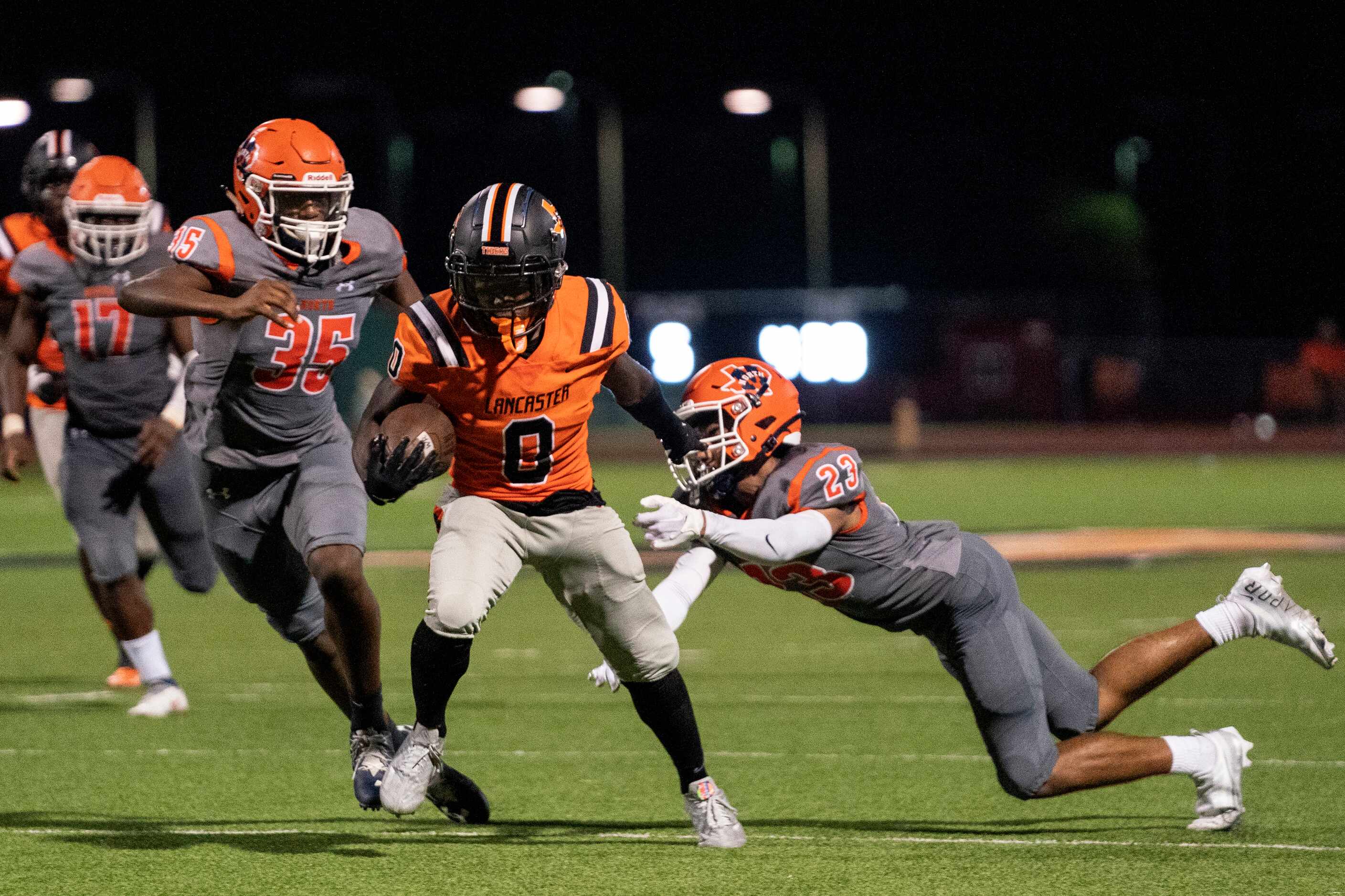 Lancaster junior wide receiver Ti’Erick Martin (0) breaks away from McKinney North junior...