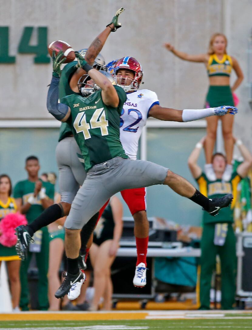 Baylor linebacker Clay Johnston (44) intercepts a pass intended for Kansas wide receiver...