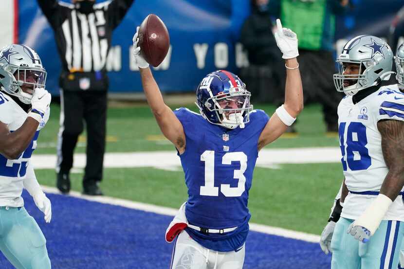 New York Giants' Dante Pettis, center, celebrates his touchdown during the first half of an...