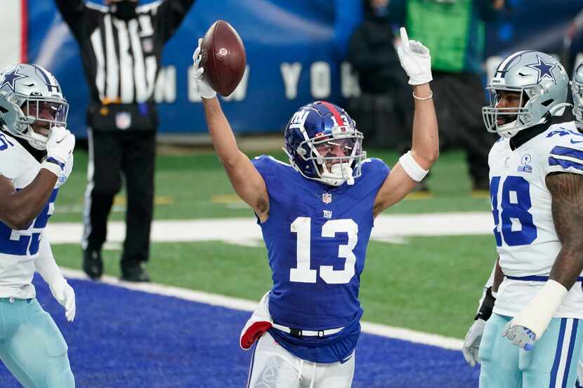 New York Giants' Dante Pettis, center, celebrates his touchdown during the first half of an...