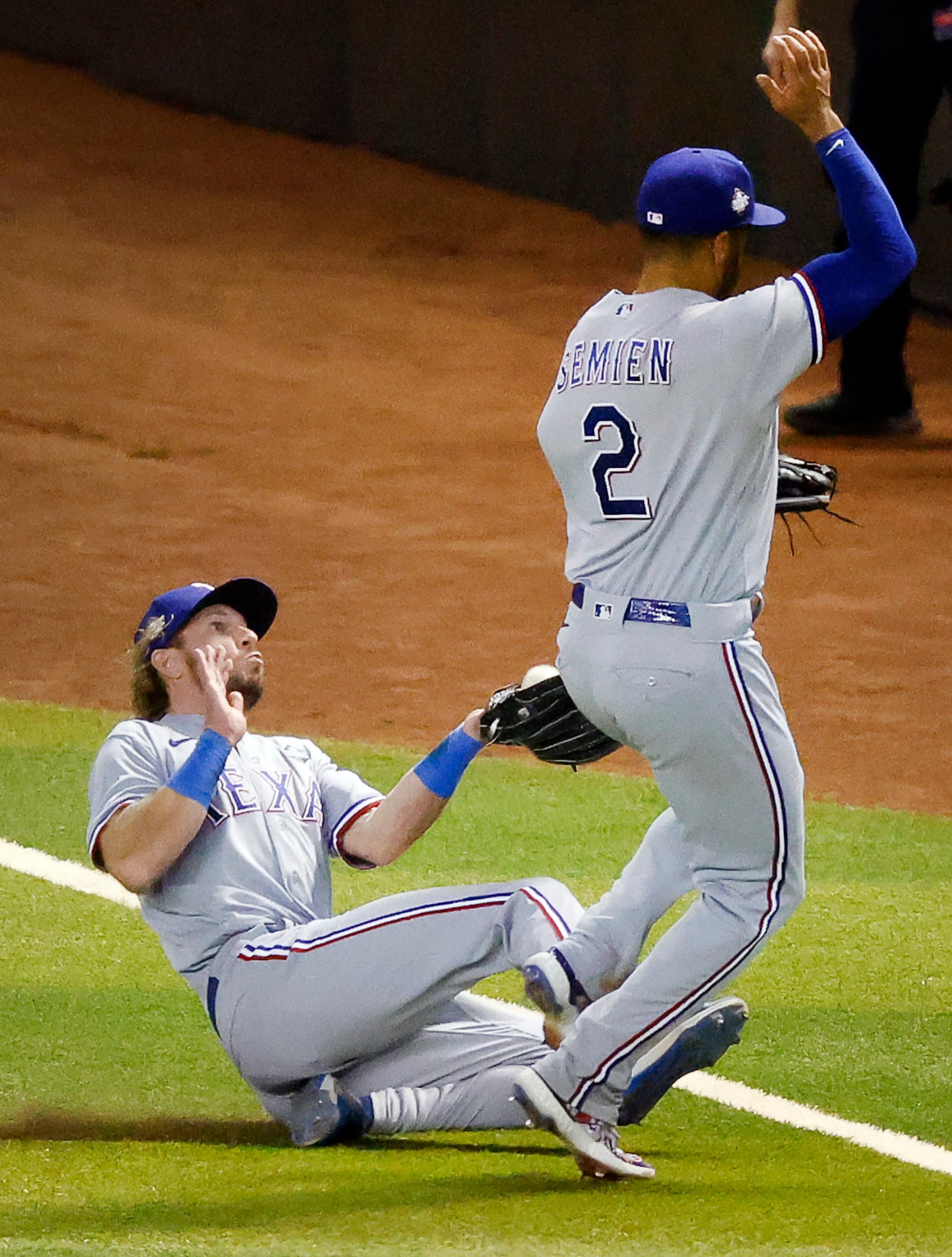 Texas Rangers right fielder Travis Jankowski makes a sliding catch on a fly ball off the bat...