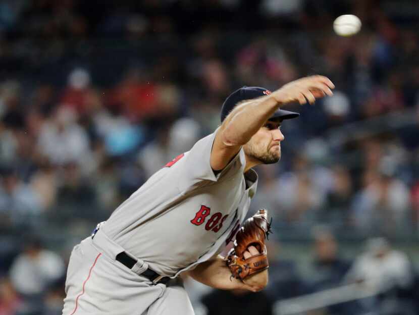 Boston Red Sox's Nathan Eovaldi delivers a pitch during the first inning of the team's...