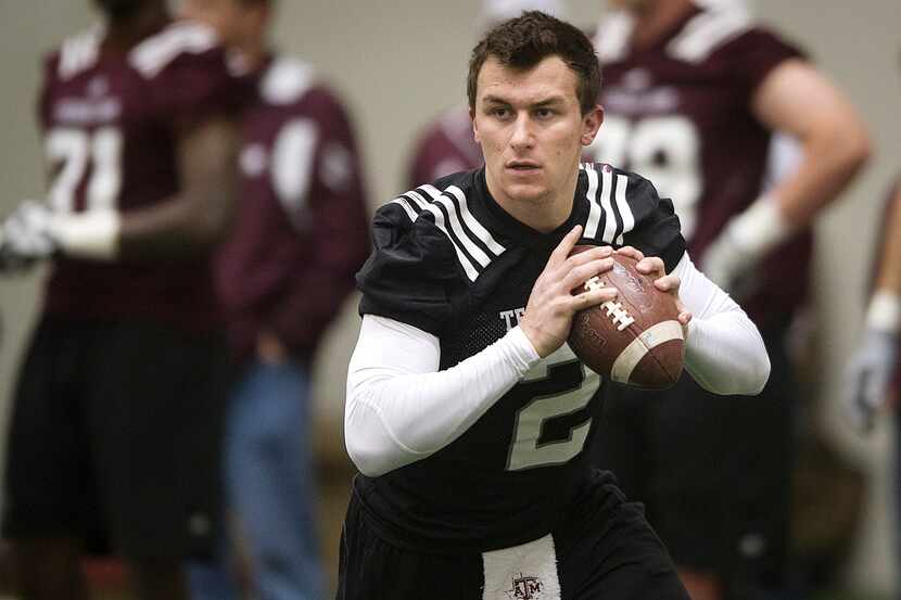 Texas A&M quarterback Johnny Manziel warms up during a spring NCAA college football practice...