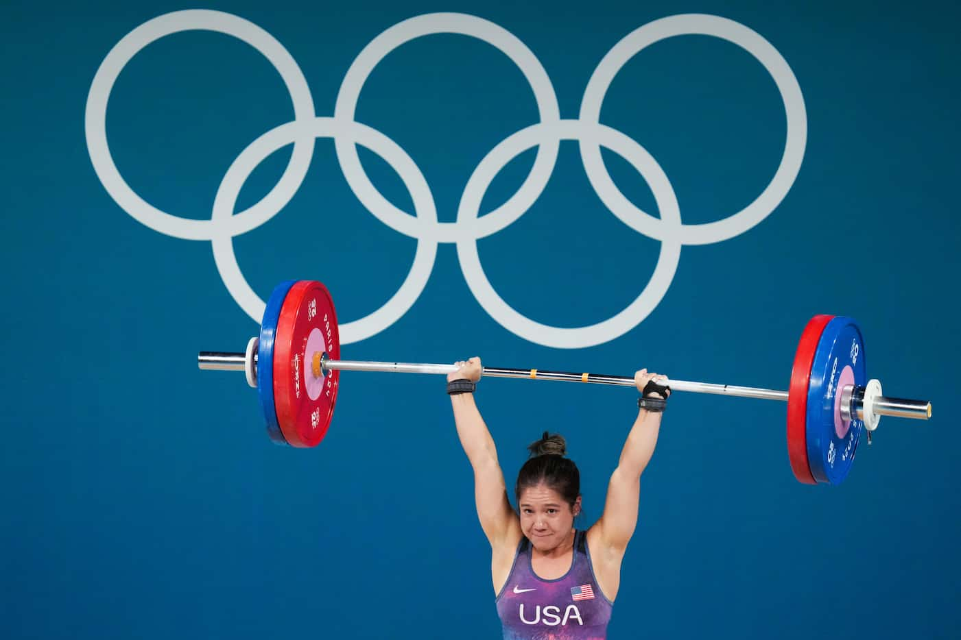 Jourdan Delacruz of the United States lifts 111kg in the clean and jerk during women’s 49kg...