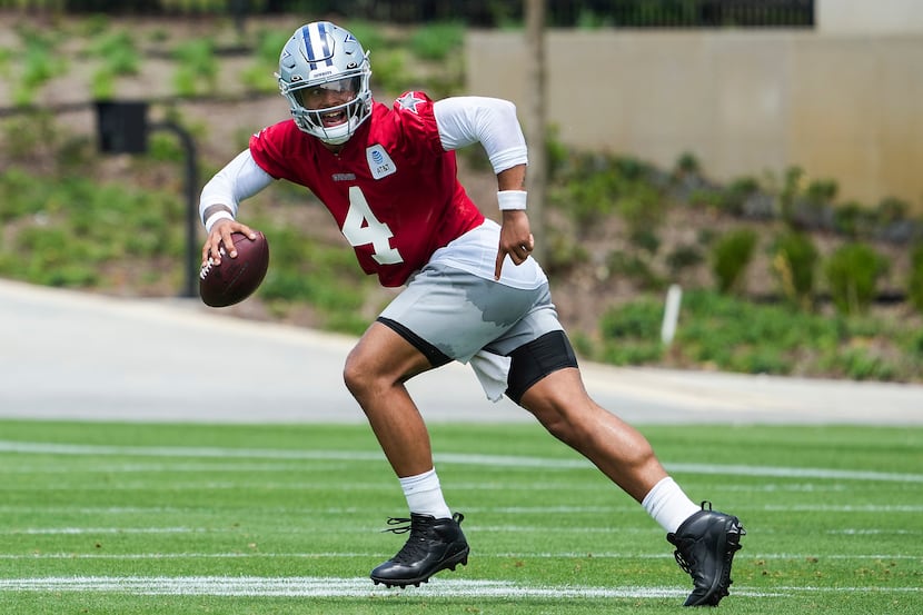 Dallas Cowboys quarterback Dak Prescott (4) runs a drill during a minicamp practice at The...