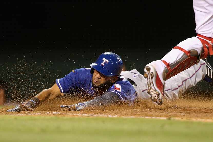 ANAHEIM, CA - JULY 19:  Nomar Mazara #30 of the Texas Rangers slides safely into home as...