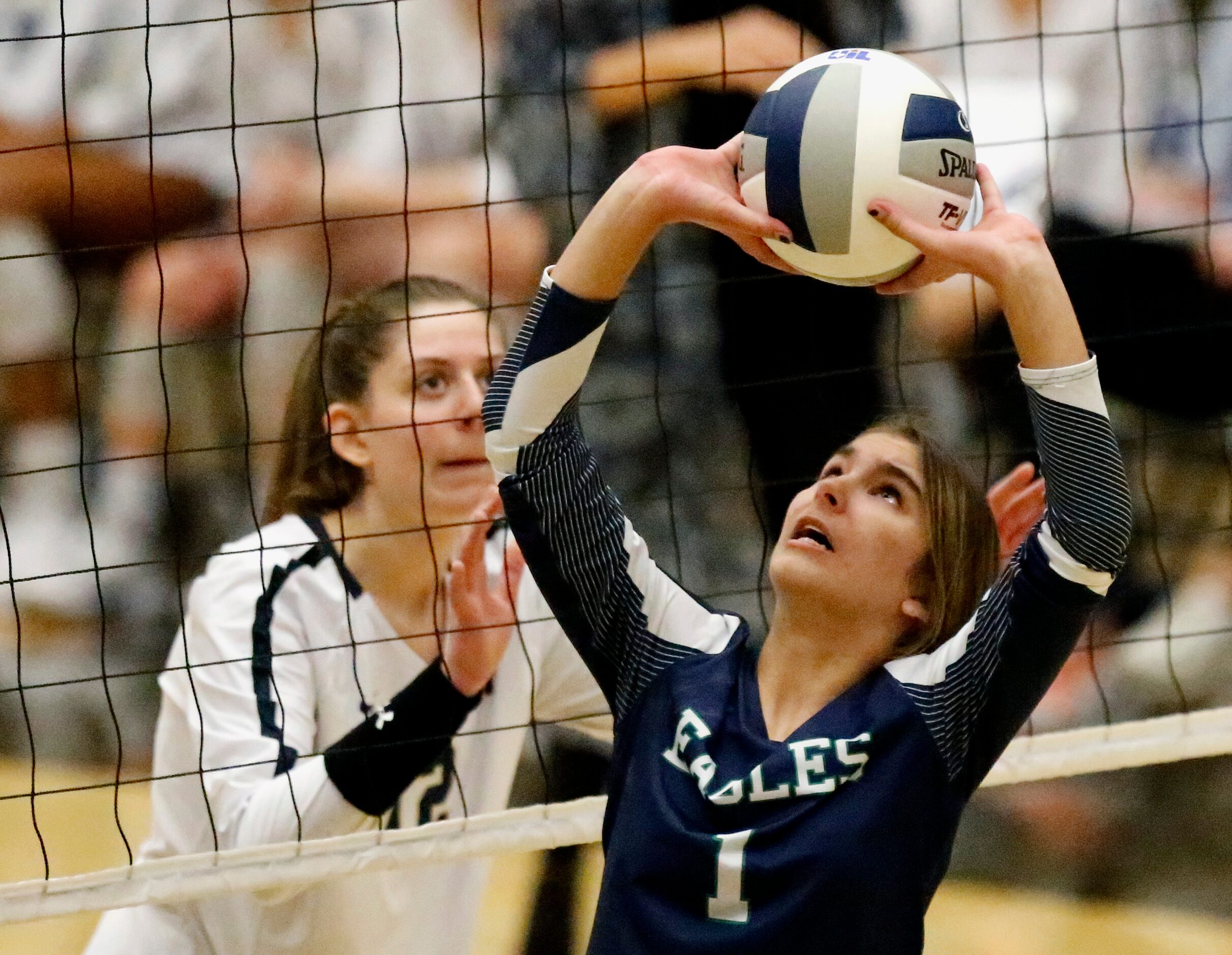 V.R. Eaton High School setter Keely Shearer (1) makes a set as Keller High School outside...