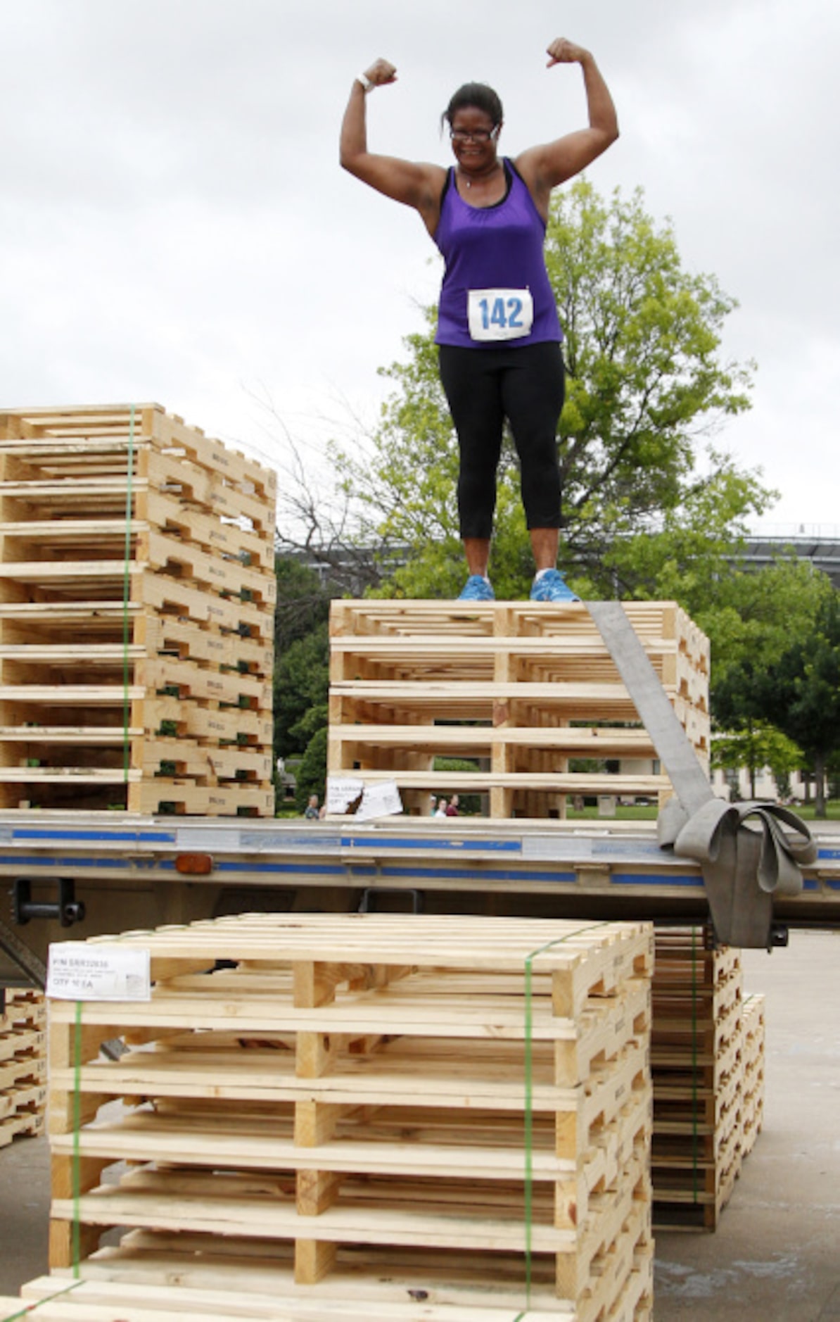 Thonisha Barnes celebrates after climbing up an obstacle during the Second Annual Fair Park...