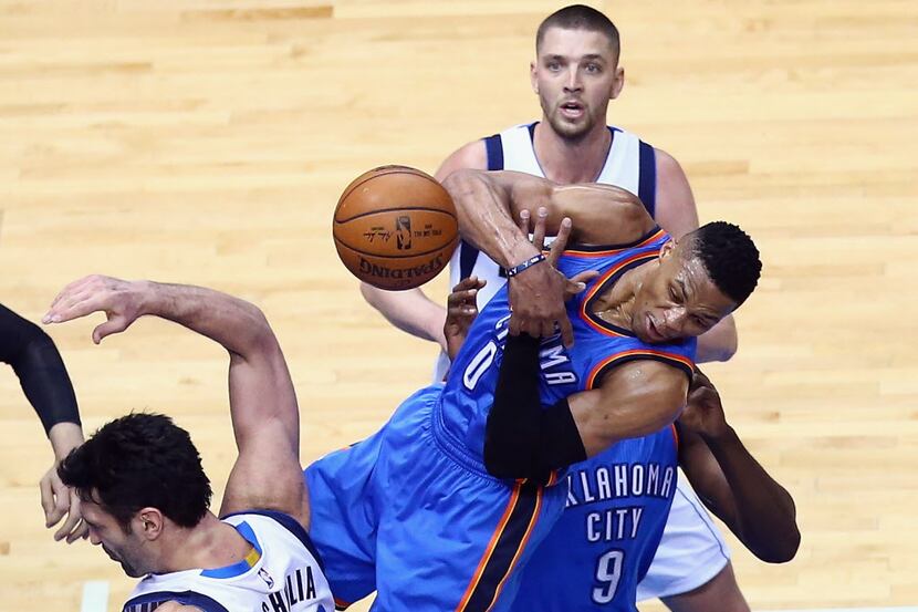 DALLAS, TX - JANUARY 22: Russell Westbrook #0 of the Oklahoma City Thunder loses the ball in...