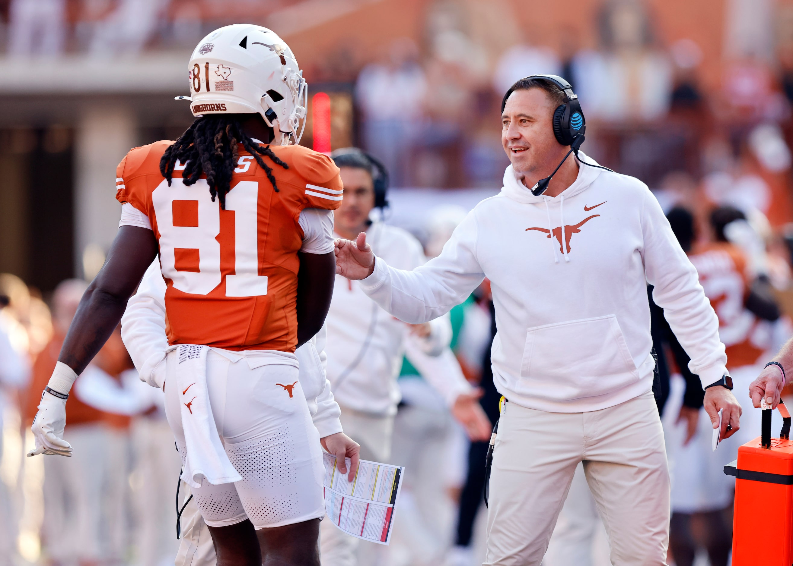 Texas Longhorns head coach Steve Sarkisian  congratulates tight end Juan Davis (81) and the...