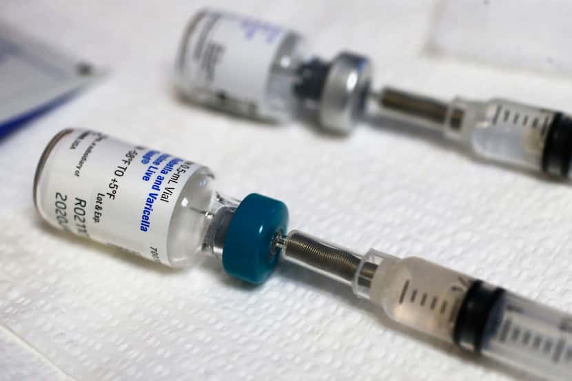 Measles and tetanus vaccine vials are ready to be administered at the Dallas County Health &...