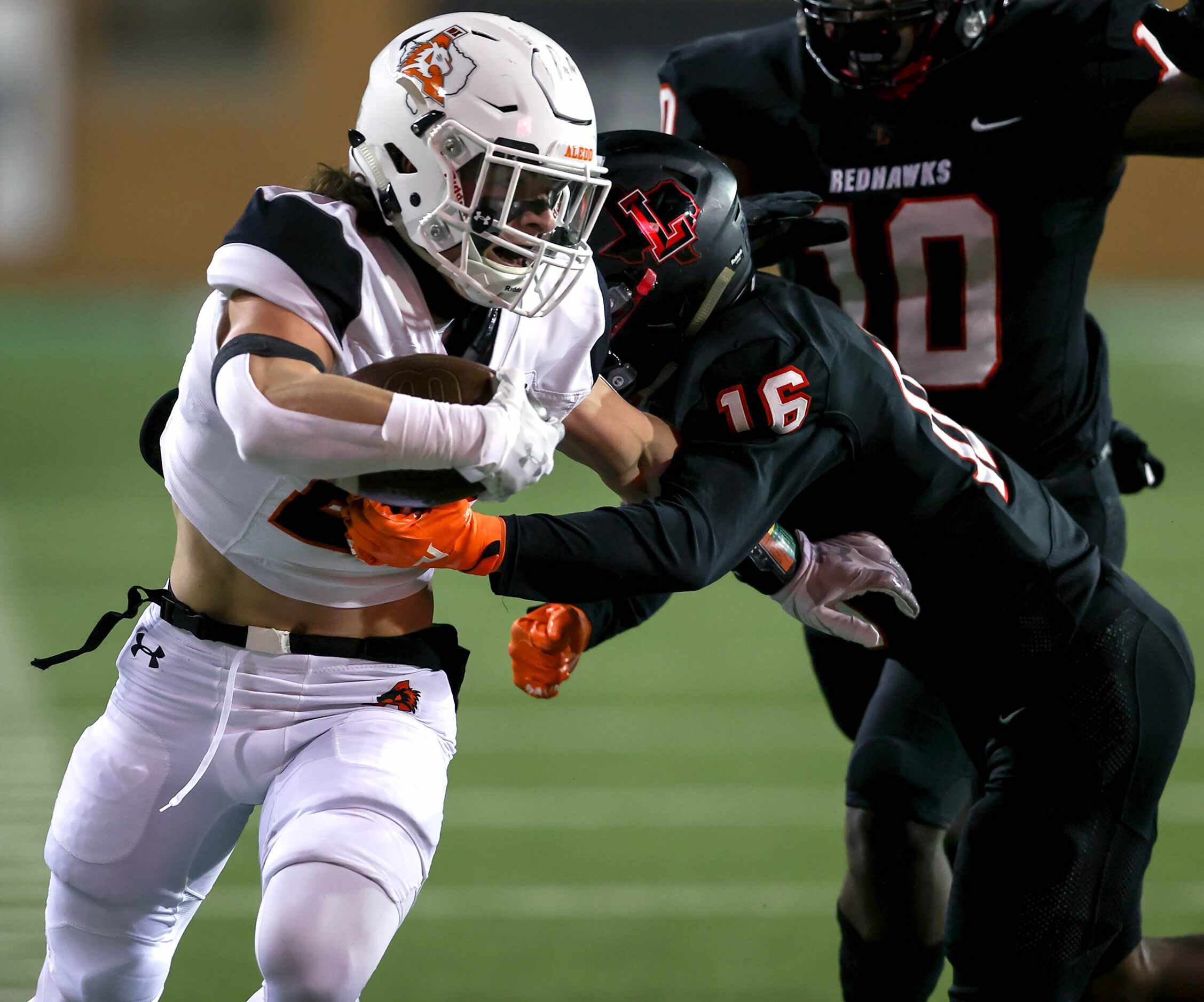 Aledo running back Sammy Steffe goes 32 yards and is stopped by Frisco Liberty cornerback...