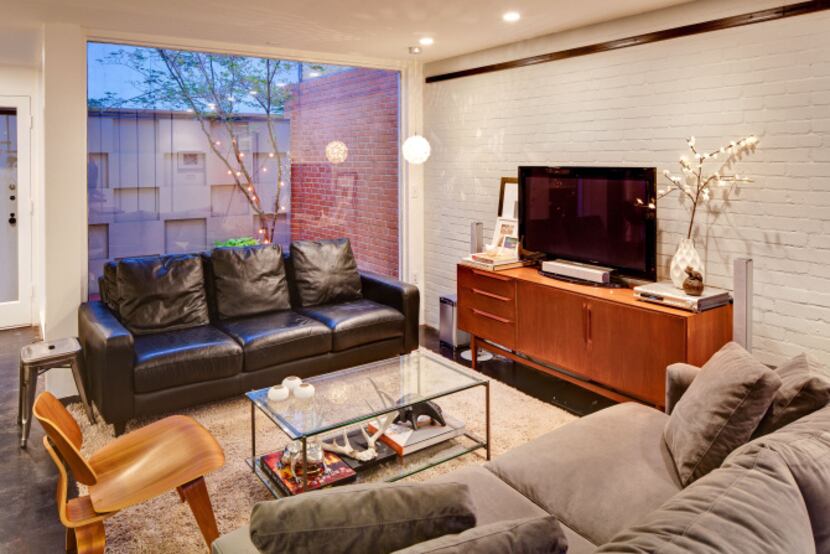 The Oak Lawn townhouse, part of an eight-unit building constructed in the late 1950s, is...