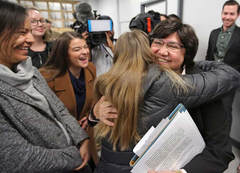 Lupe Valdez is hugged by well-wishers after her announcement at a news conference Wednesday...