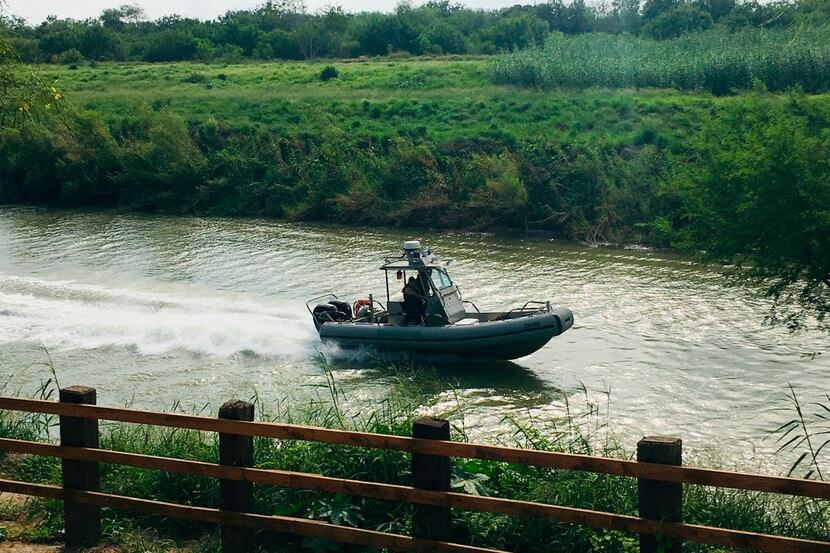 A U.S. Border Patrol boat navigates the Rio Grande near where the bodies of Salvadoran...