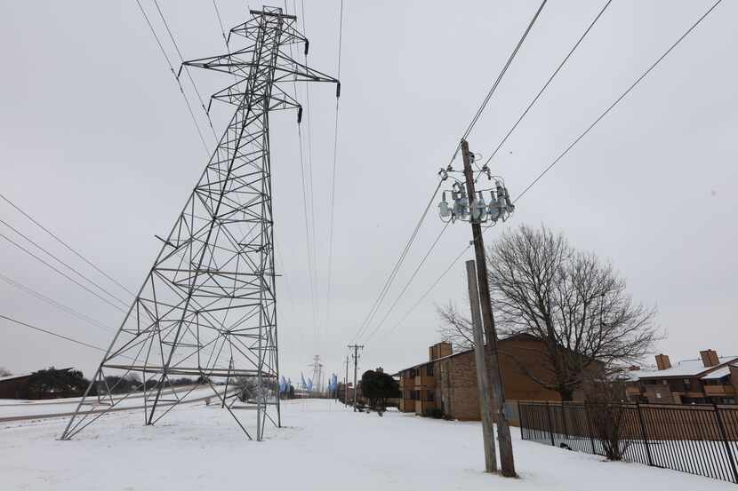 FORT WORTH, TX - FEBRAURY 17: A transmission tower supports power lines after a snow storm...