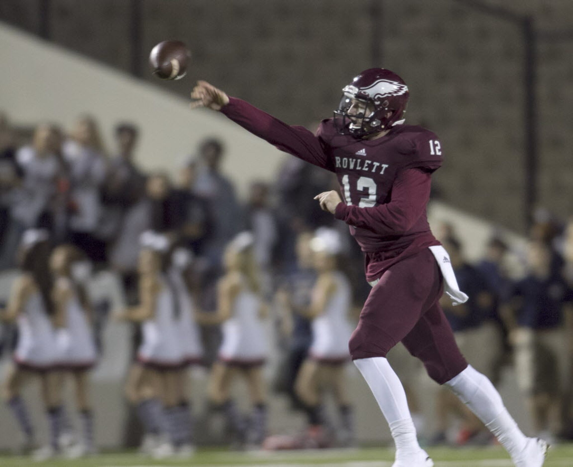 Rowlett quarterback Logan Bonner (12) releases a pass downfield during second quarter action...