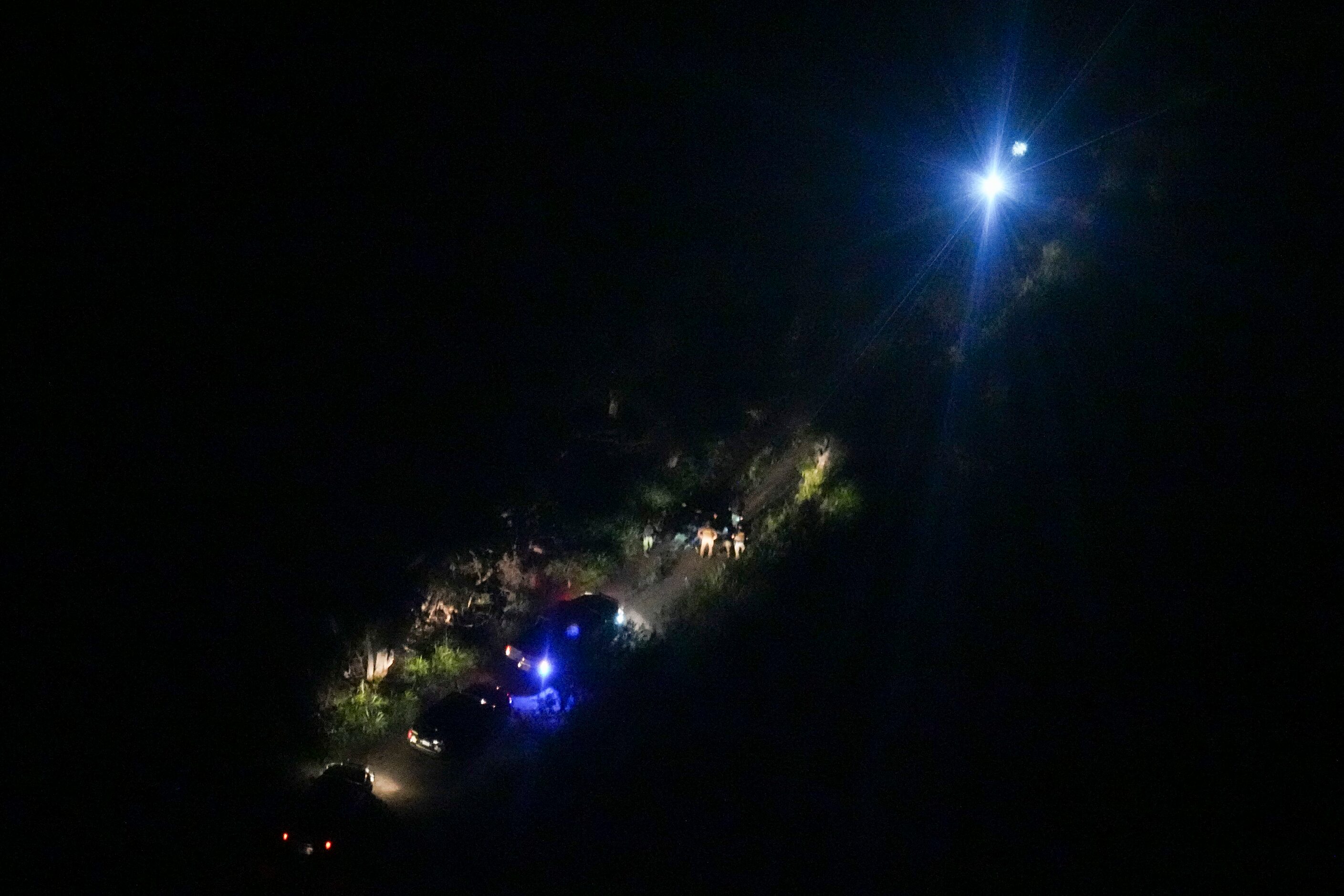 A group migrants is seen from a Texas Department of Public Safety helicopter after being...