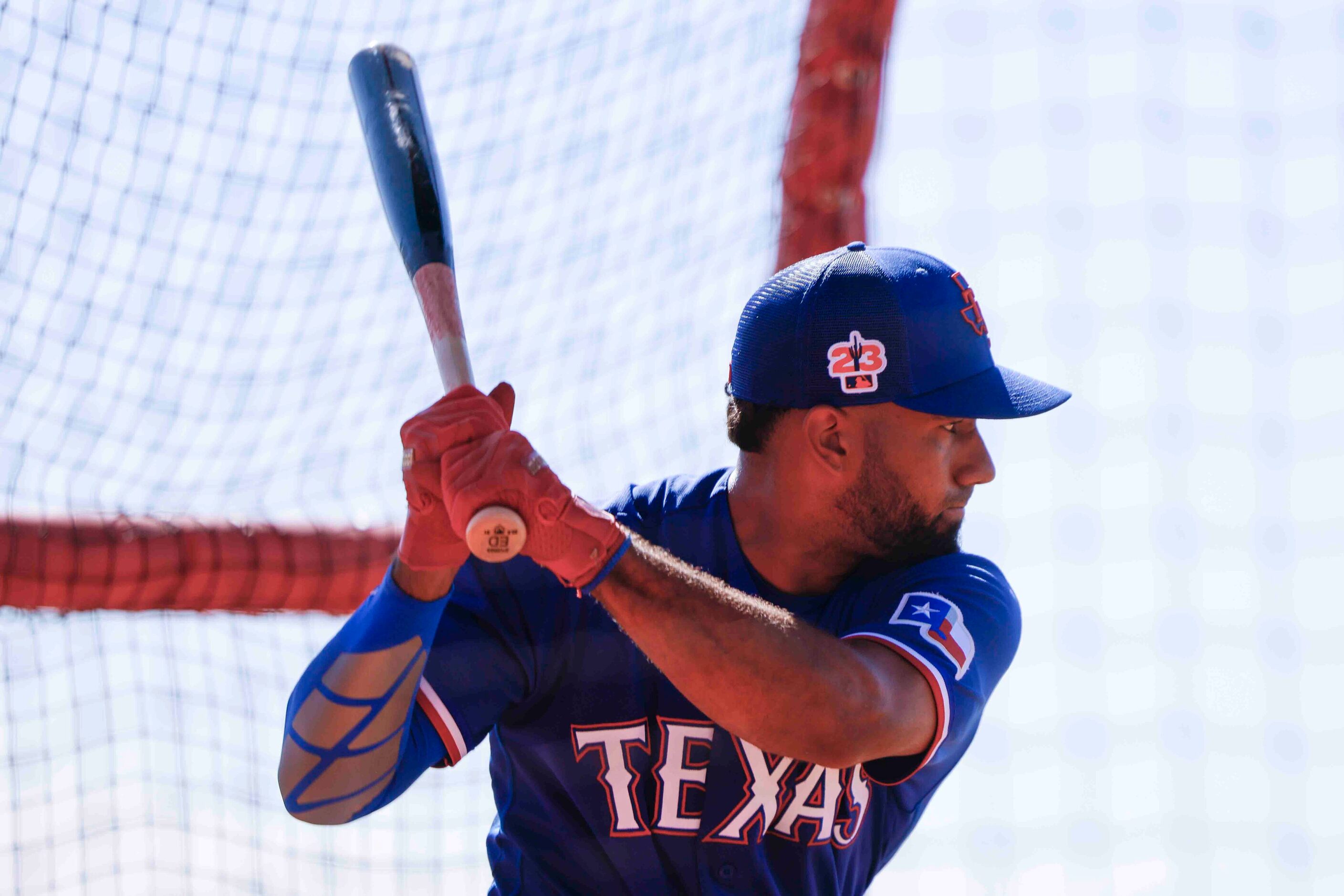 Texas Rangers infielder Ezequiel Durán takes part in a batting practice during a spring...