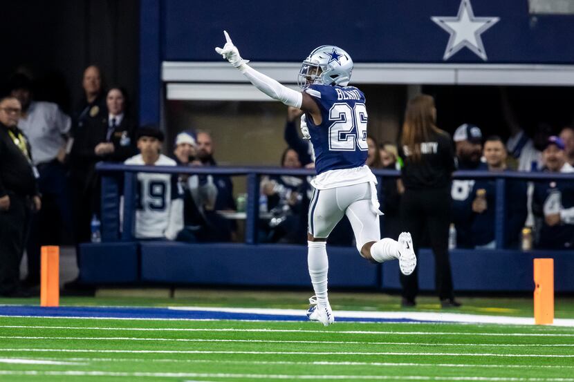 Dallas Cowboys cornerback DaRon Bland (26) runs back an interception for a touchdown during...
