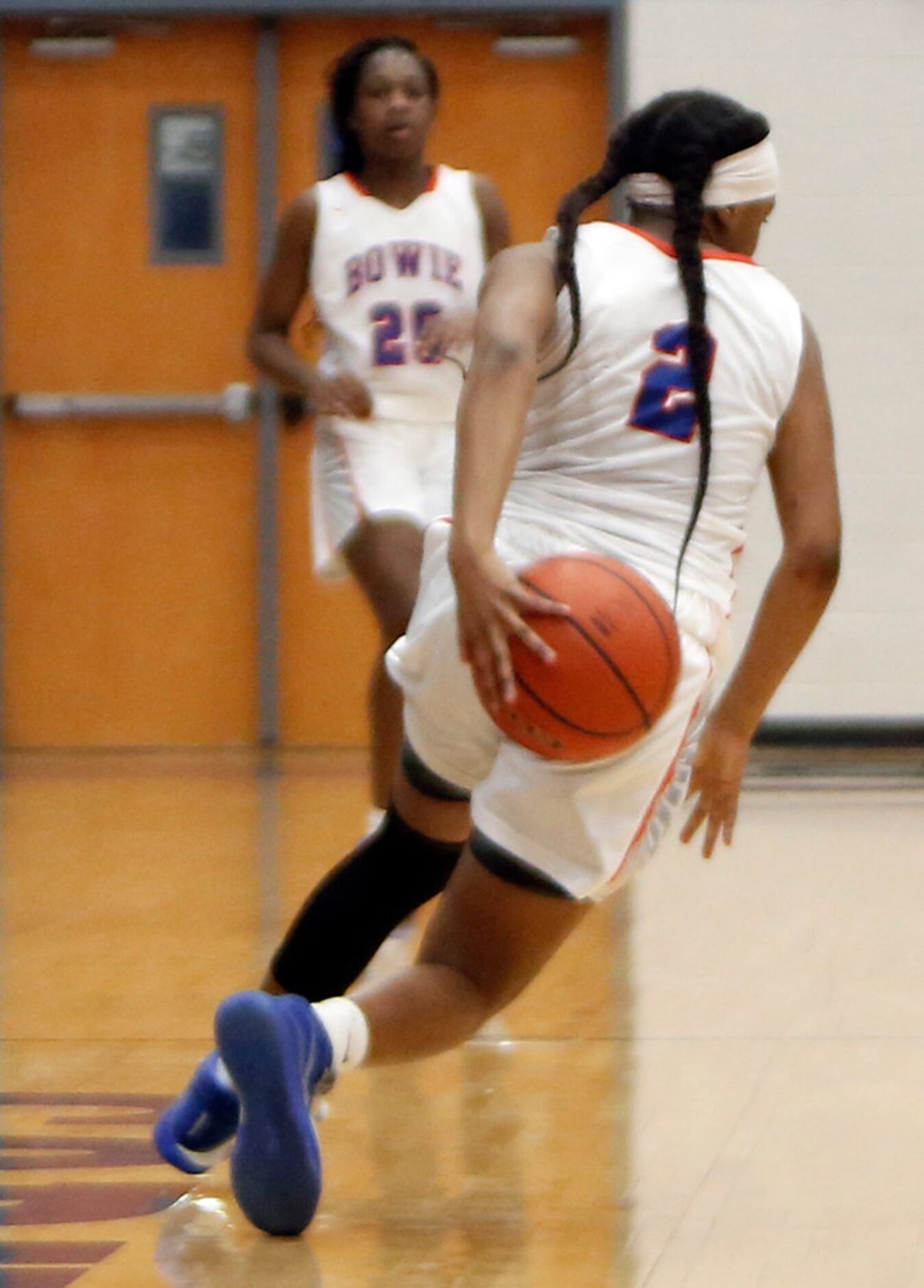 Arlington Bowie guard Seniya Wilson (2) dribbles behind her back as she brings the ball past...