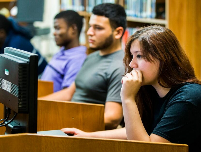 
Students (from left) Carlie Dingao, Francisco Diaz and Kathy Ramirez study at the Christa...