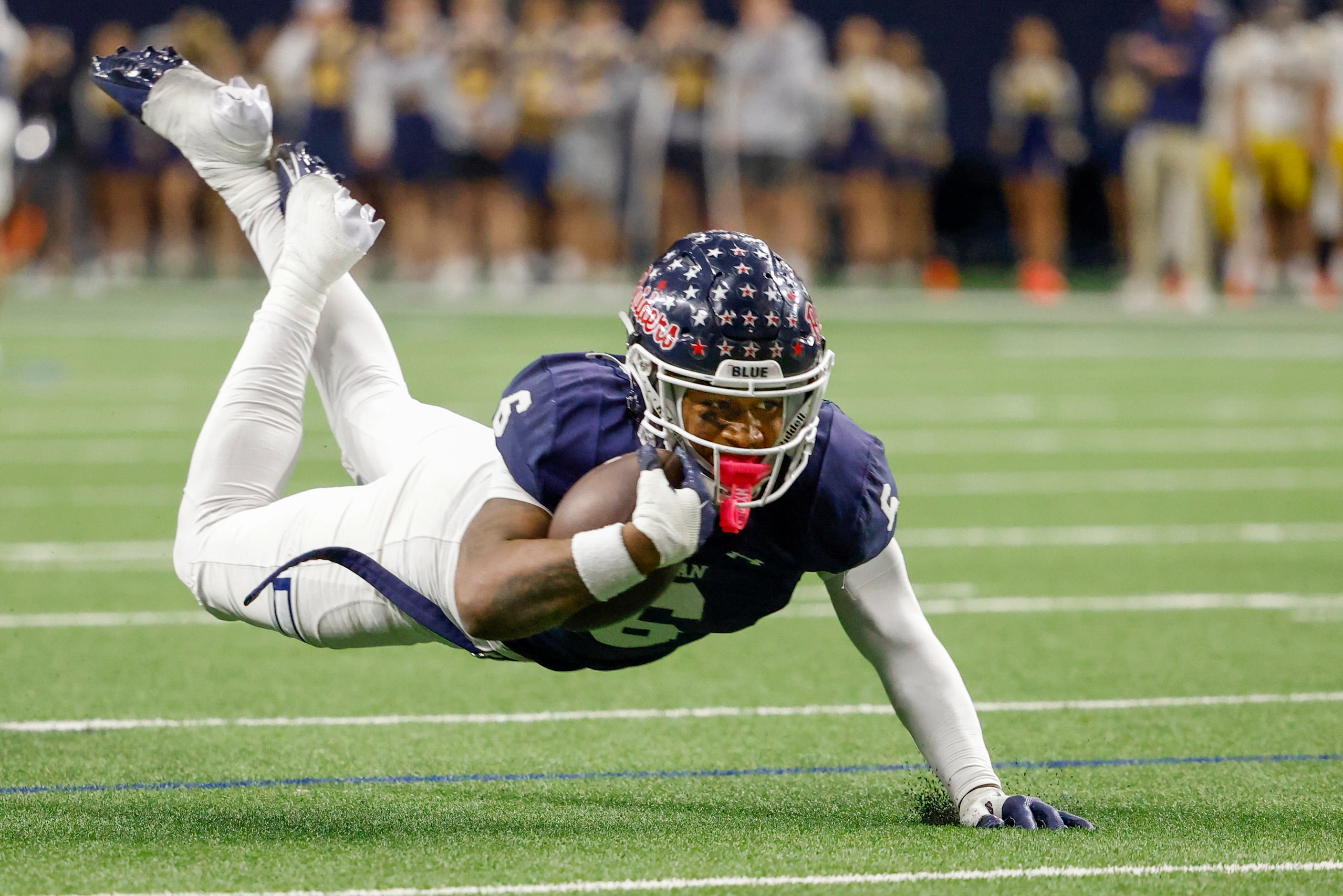 Denton Ryan running back Nemo Warmate (6) is tripped up short of the goal line during the...