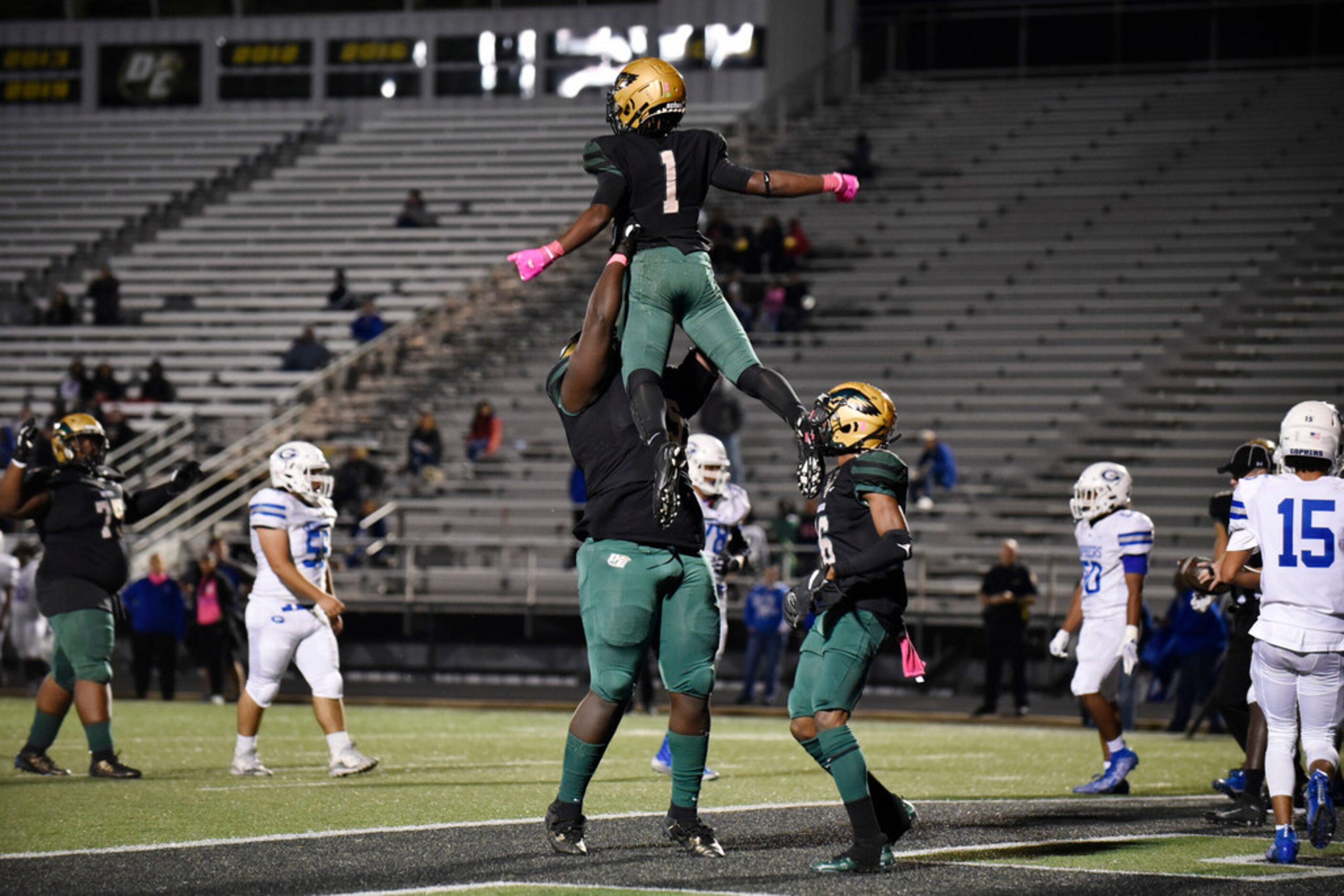 DeSoto High School senior offensive lineman Ar'Maj Adams (55) lifts senior wide receiver...