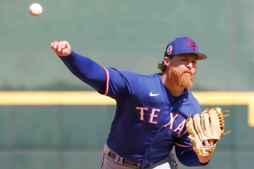 Texas Rangers pitcher Jon Gray delivers during the second inning of a spring training game...