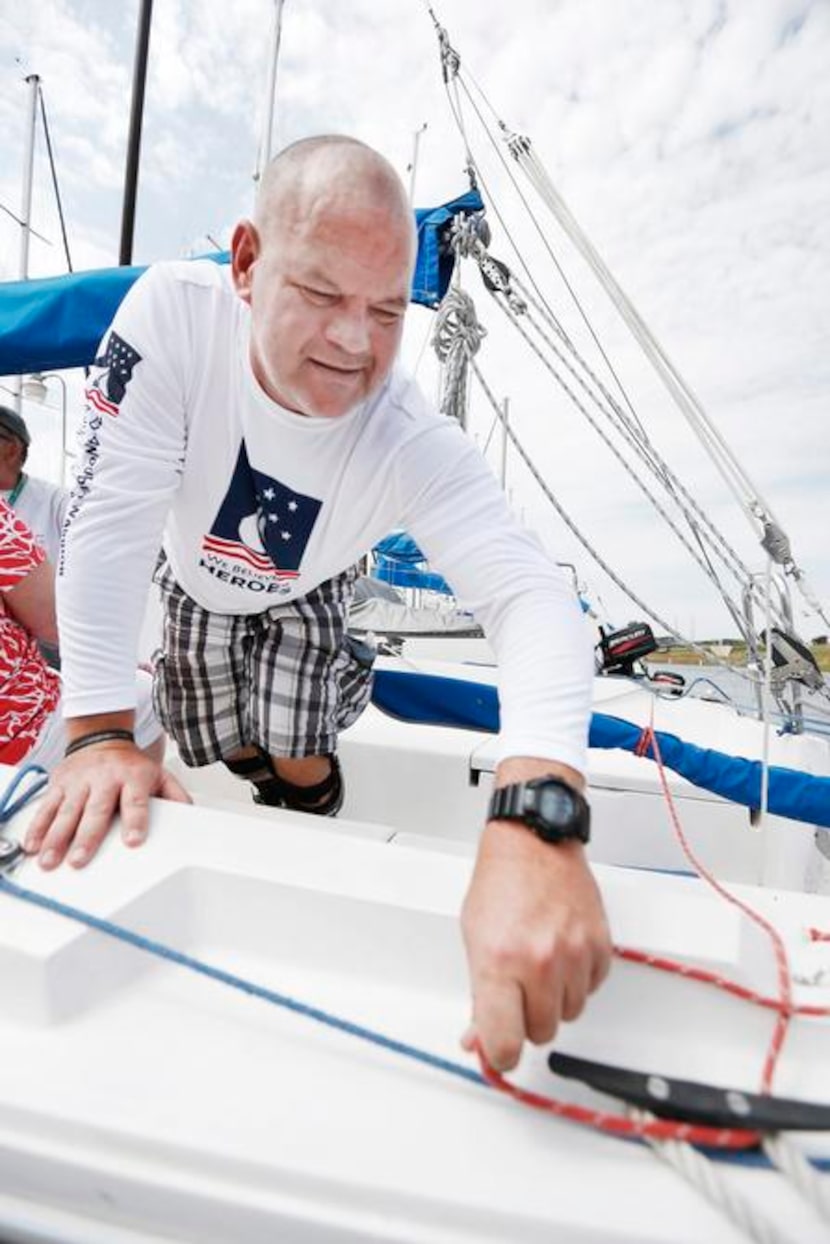 
Jay Boyd, Navy chief select and Air Force tech sergeant, unties a rudder tie line during...