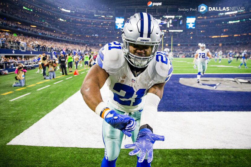 Dallas Cowboys running back Ezekiel Elliott celebrates after scoring on a 55-yard touchdown...