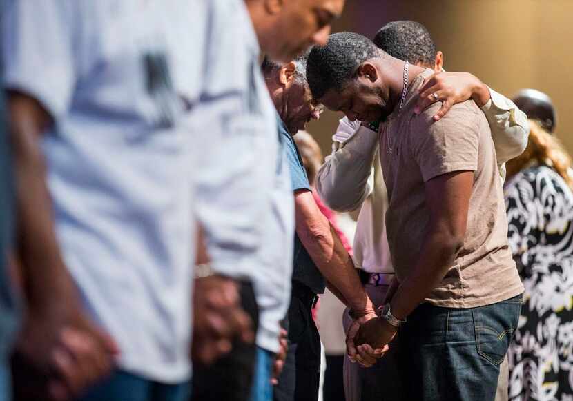 
Joshua Taylor, brother of Christian Taylor, is prayed over.
