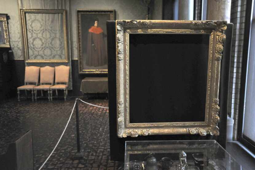 In this Thursday, March 11, 2010 file photo, empty frames from which thieves took "Storm on...