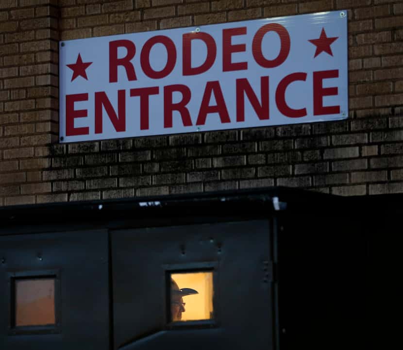 An usher is seen through the rodeo entrance doors of Will Rogers Memorial Coliseum at the...