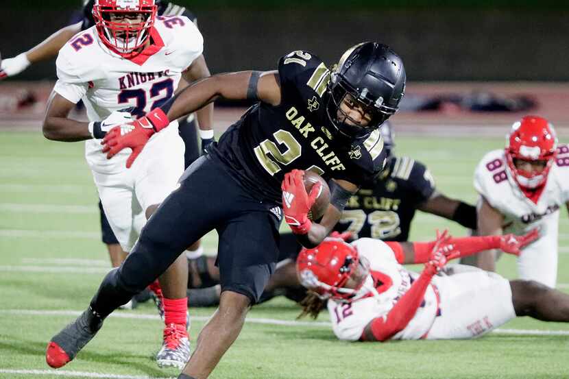 South Oak Cliff High School running back Danny Green Jr (21) keeps his balance during the...