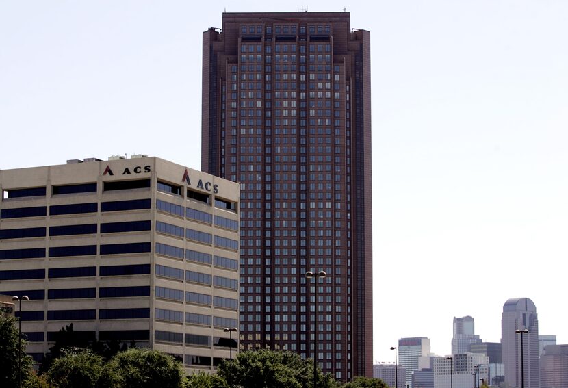 The former Affiliated Computer Services building is shown in front of the CityPlace tower.