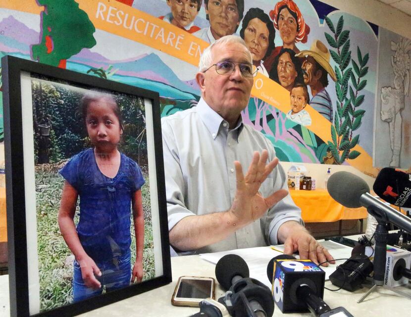 Annunciation House director Ruben Garcia answers questions from the media after reading a...